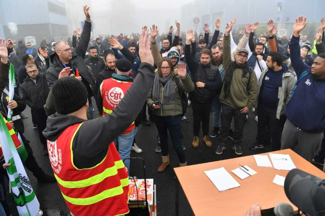 Workers take part in a general assembly at the Michelin plant in Cholet, western France