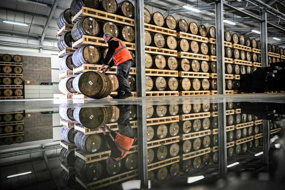 Distiller Donald MacLeod, 27, rolls a barrel of whisky in the warehouse on the island where he has bought a house and hopes to stay Distiller Donald MacLeod, 27, rolls a barrel of whisky in the warehouse on the island where he has bought a house and hopes to stay