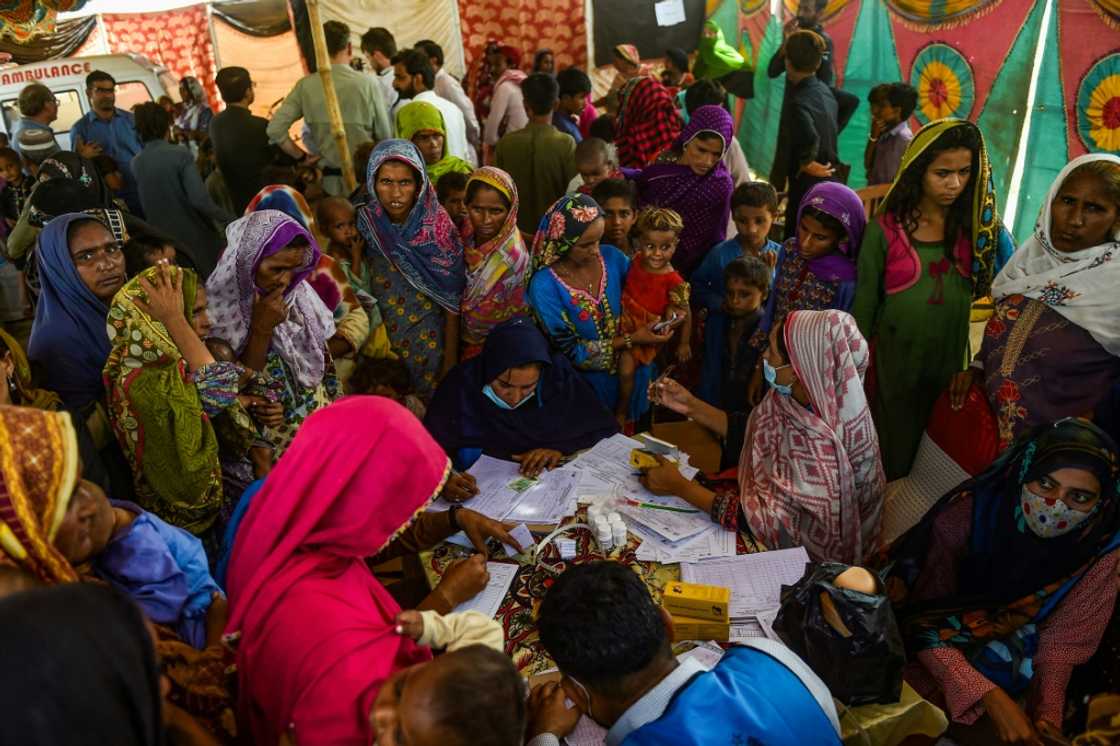 Pakistani internally displaced people at a medical camp in Sindh province -- worst-hit by the catastrophic flooding which put a third of Pakistan under water -- on September 27, 2022 Pakistani internally displaced people at a medical camp in Sindh province -- worst-hit by the catastrophic flooding which put a third of Pakistan under water -- on September 27, 2022
