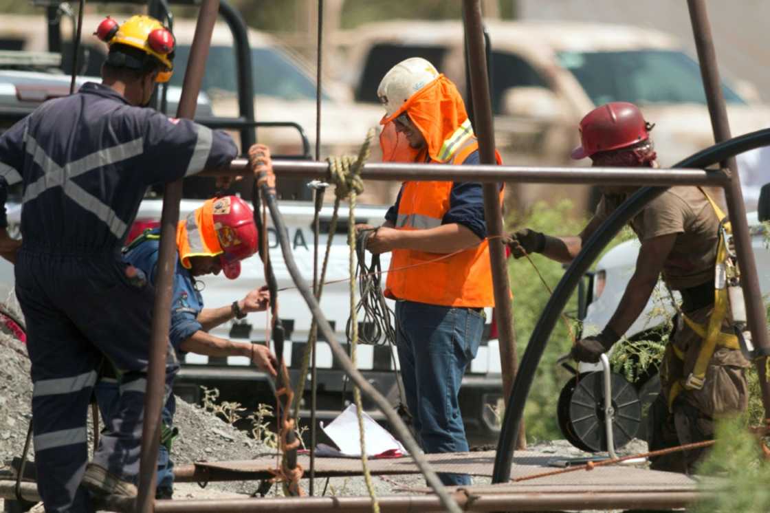 Rescue personnel work in the flooded coal mine where 10 miners have been trapped after a landslide, in the community of Agujita, Municipality of Sabinas, Coahuila State, Mexico