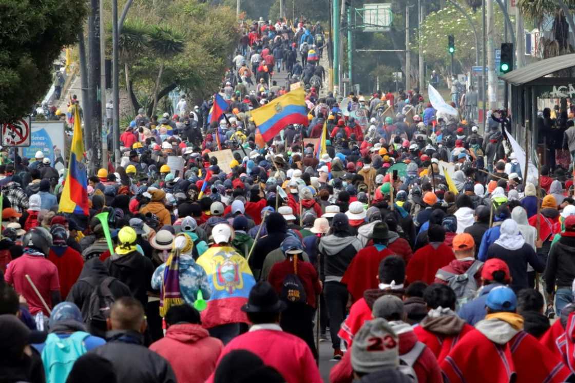 Indigenous people march towards the Central University of Ecuador (UCE) in Quito, on June 22, 2022, on the tenth consecutive day of indigenous-led protests against the Ecuadoran government Indigenous people march towards the Central University of Ecuador (UCE) in Quito, on June 22, 2022, on the tenth consecutive day of indigenous-led protests against the Ecuadoran government