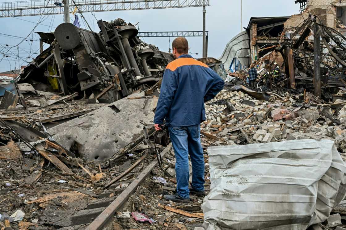 A worker inspects the damage near a railway yard of the freight railway station in Kharkiv, which was partially destroyed by a missile strike A worker inspects the damage near a railway yard of the freight railway station in Kharkiv, which was partially destroyed by a missile strike