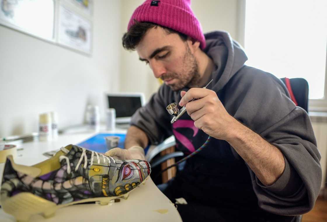 Using an array of paints, Satja Grabuloski and his team of seven artists turn ordinary shoes into works of art Using an array of paints, Satja Grabuloski and his team of seven artists turn ordinary shoes into works of art