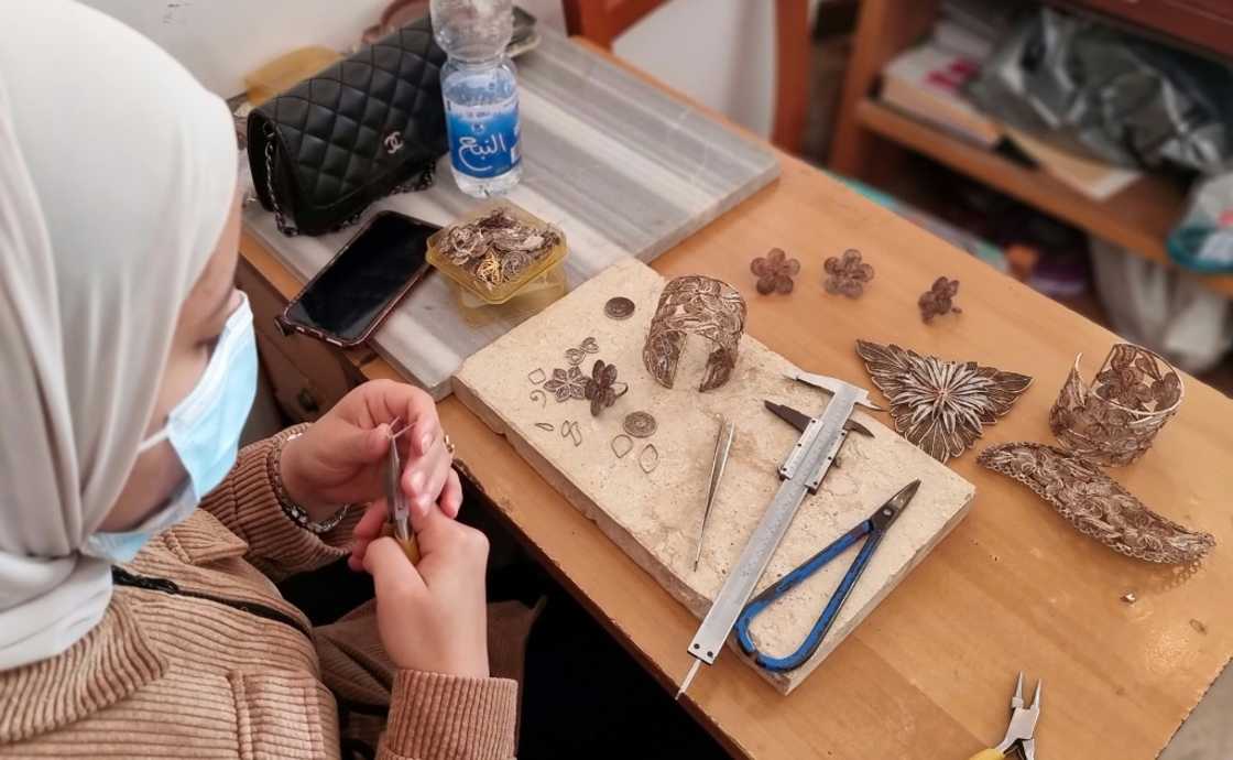 Beads and threads of the precious materials are woven into intricate designs then soldered together Beads and threads of the precious materials are woven into intricate designs then soldered together