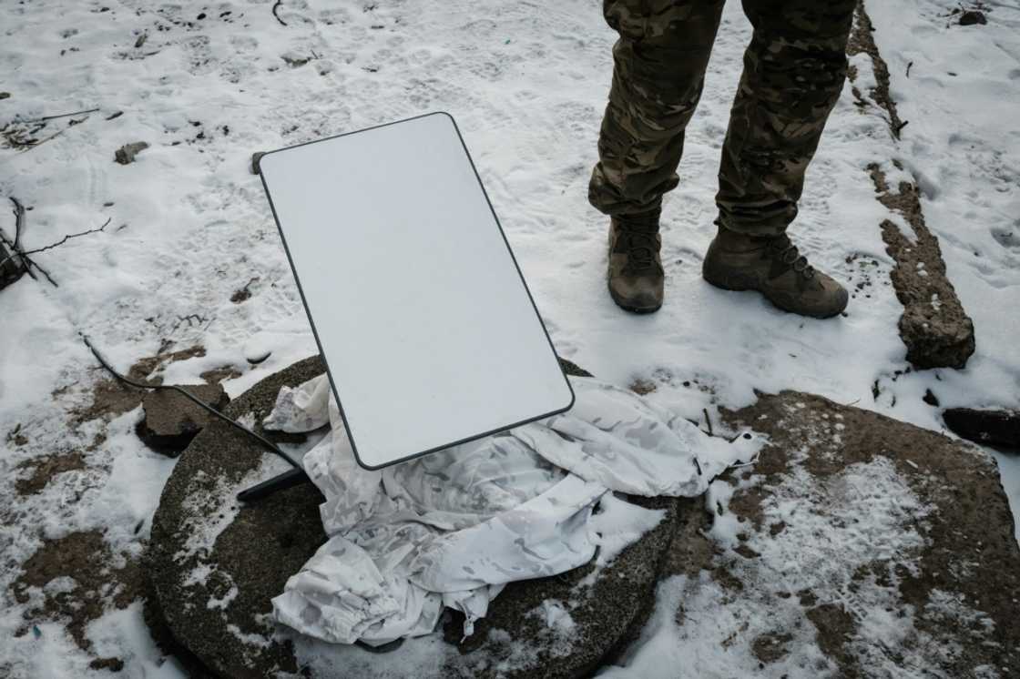 A Ukrainian serviceman stands next to the antenna of a Starlink satellite-based broadband system in Bakhmut in February 2023 A Ukrainian serviceman stands next to the antenna of a Starlink satellite-based broadband system in Bakhmut in February 2023