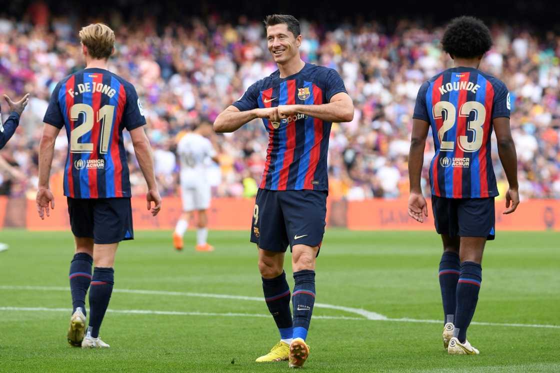 Robert Lewandowski (C) and Jules Kounde (R) were among Barcelona's big-name summer signings while the club failed to persuade Frenkie de Jong (L) to leave Robert Lewandowski (C) and Jules Kounde (R) were among Barcelona's big-name summer signings while the club failed to persuade Frenkie de Jong (L) to leave