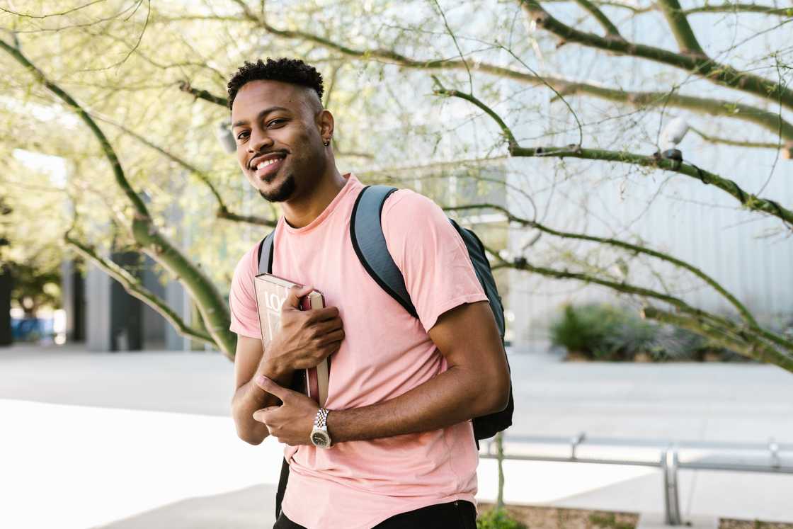 A college student holding books