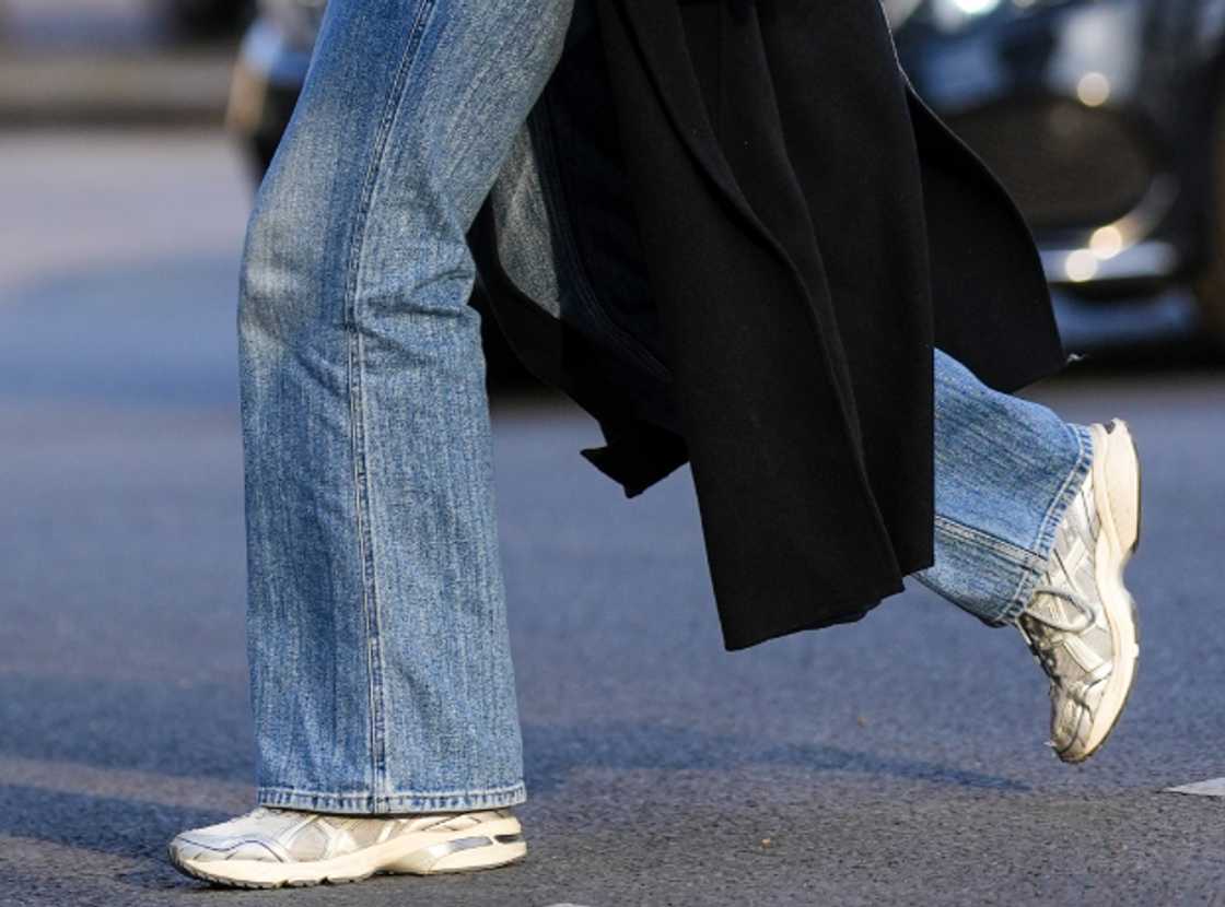 A woman with a pair of chunky sneakers A woman with a pair of chunky sneakers