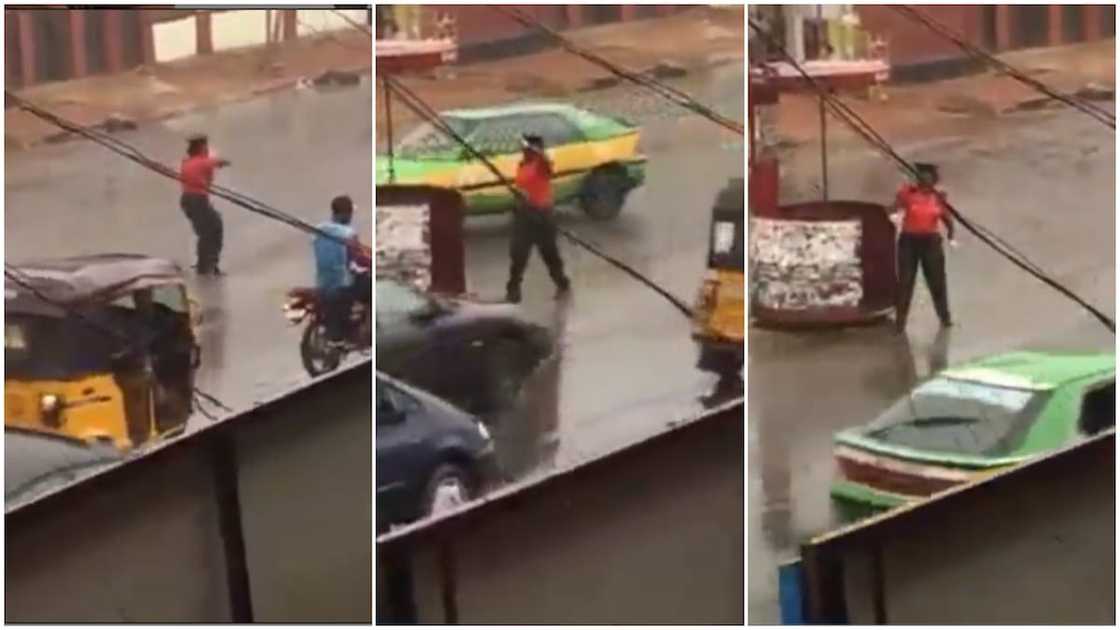 Heartwarming Moment Female Officer Controls Traffic under Heavy Rain in Kwara state, her Video Goes Viral Heartwarming Moment Female Officer Controls Traffic under Heavy Rain in Kwara state, her Video Goes Viral