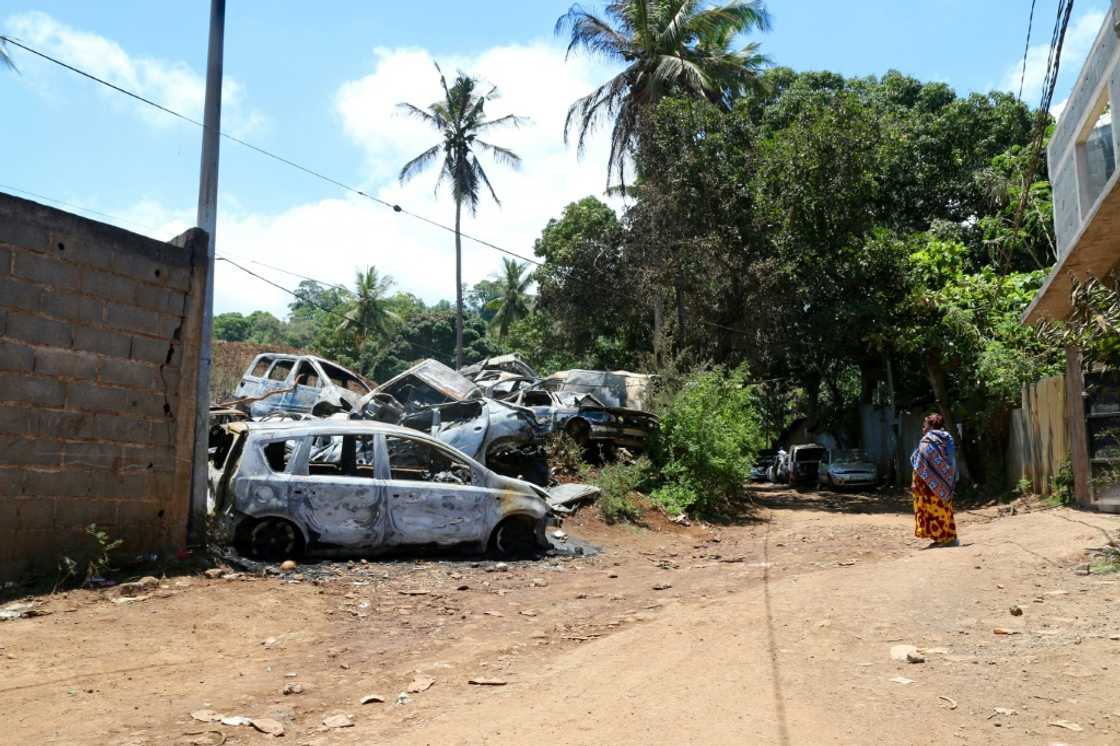Burned-out cars as a result of ongoing gang violence in the main town in Mayotte Burned-out cars as a result of ongoing gang violence in the main town in Mayotte