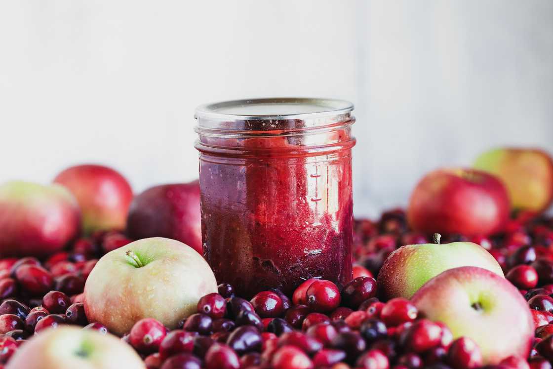 Homemade canned cranberry apple preserves with fresh fruit Homemade canned cranberry apple preserves with fresh fruit