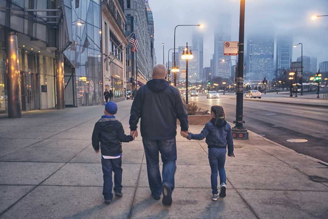 Family walking down Michigan Avenue in Chicago Family walking down Michigan Avenue in Chicago