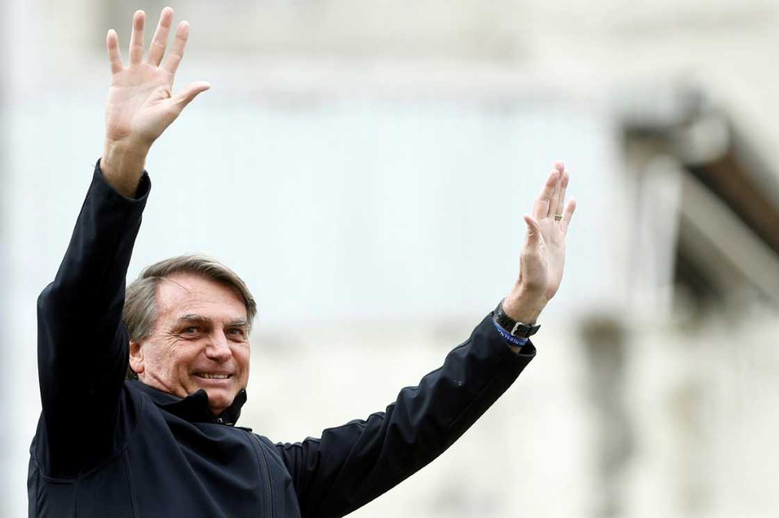 Brazil's President and presidential candidate Jair Bolsonaro gestures during a rally as part of his re-election campaign in Curitiba, Parana State, Brazil, on August 31, 2022 Brazil's President and presidential candidate Jair Bolsonaro gestures during a rally as part of his re-election campaign in Curitiba, Parana State, Brazil, on August 31, 2022