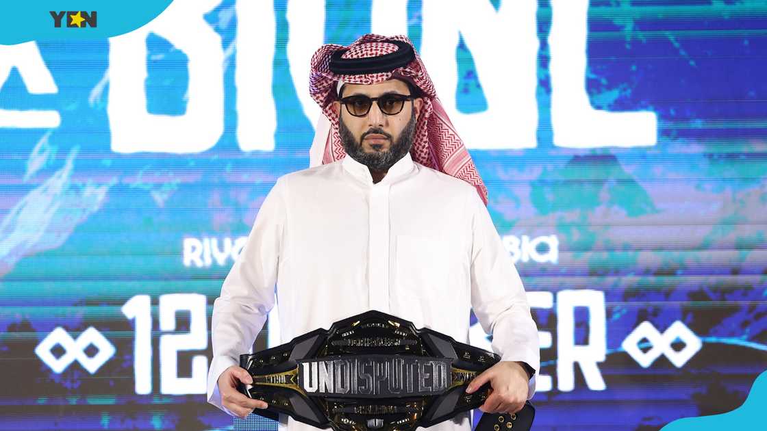 Turki Alalshikh holds the Undisputed belt during a weigh-in in Riyadh, Saudi Arabia. Turki Alalshikh holds the Undisputed belt during a weigh-in in Riyadh, Saudi Arabia.
