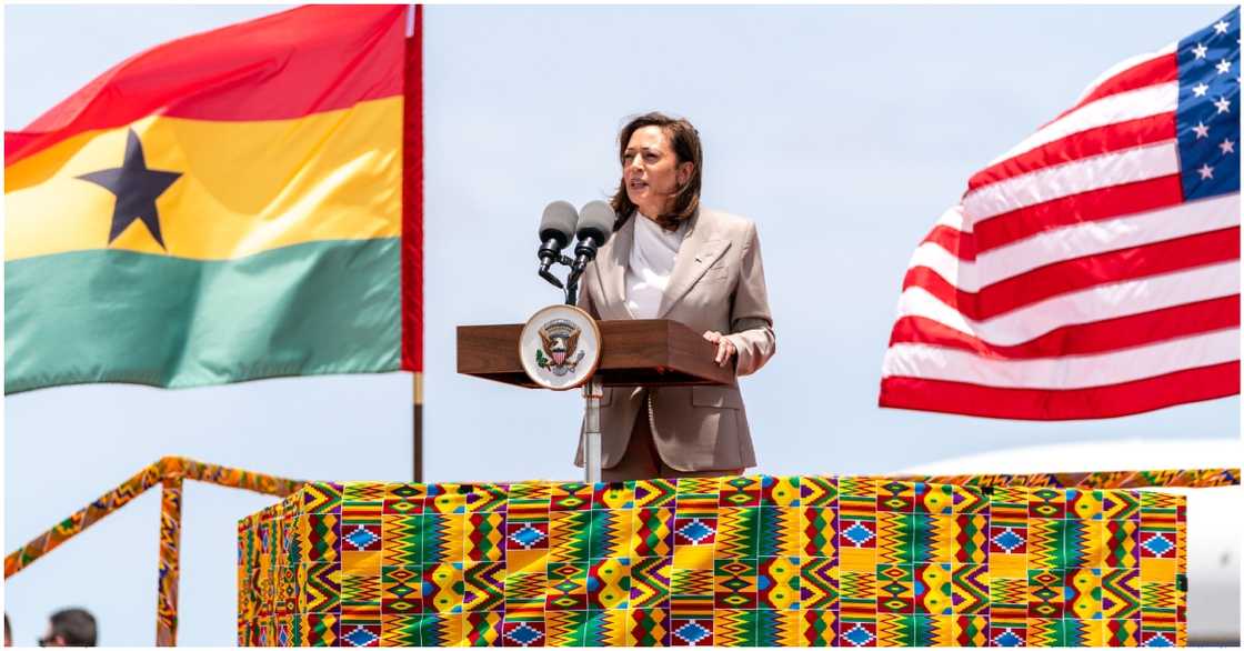 Photo of US veep Kamala Harris speaking on stage designed with Kente in Ghana