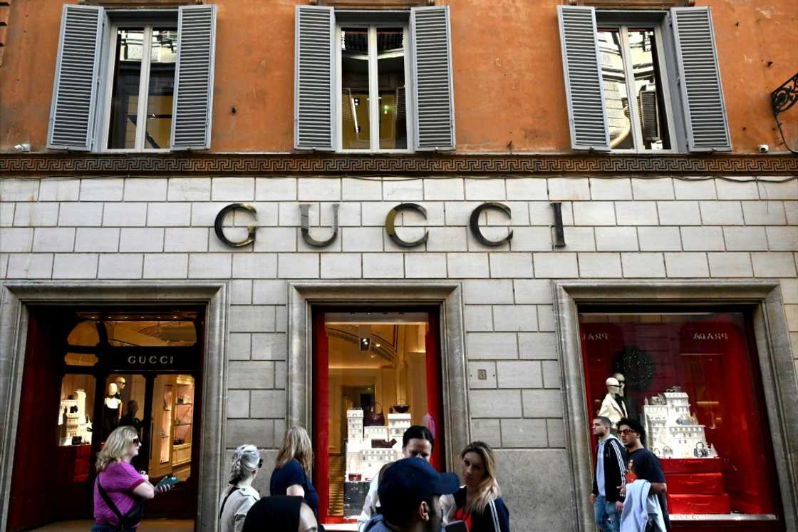 Despite a drop in earnings, shares in Gucci's parent company jumped as the results were not as bad as feared Despite a drop in earnings, shares in Gucci's parent company jumped as the results were not as bad as feared