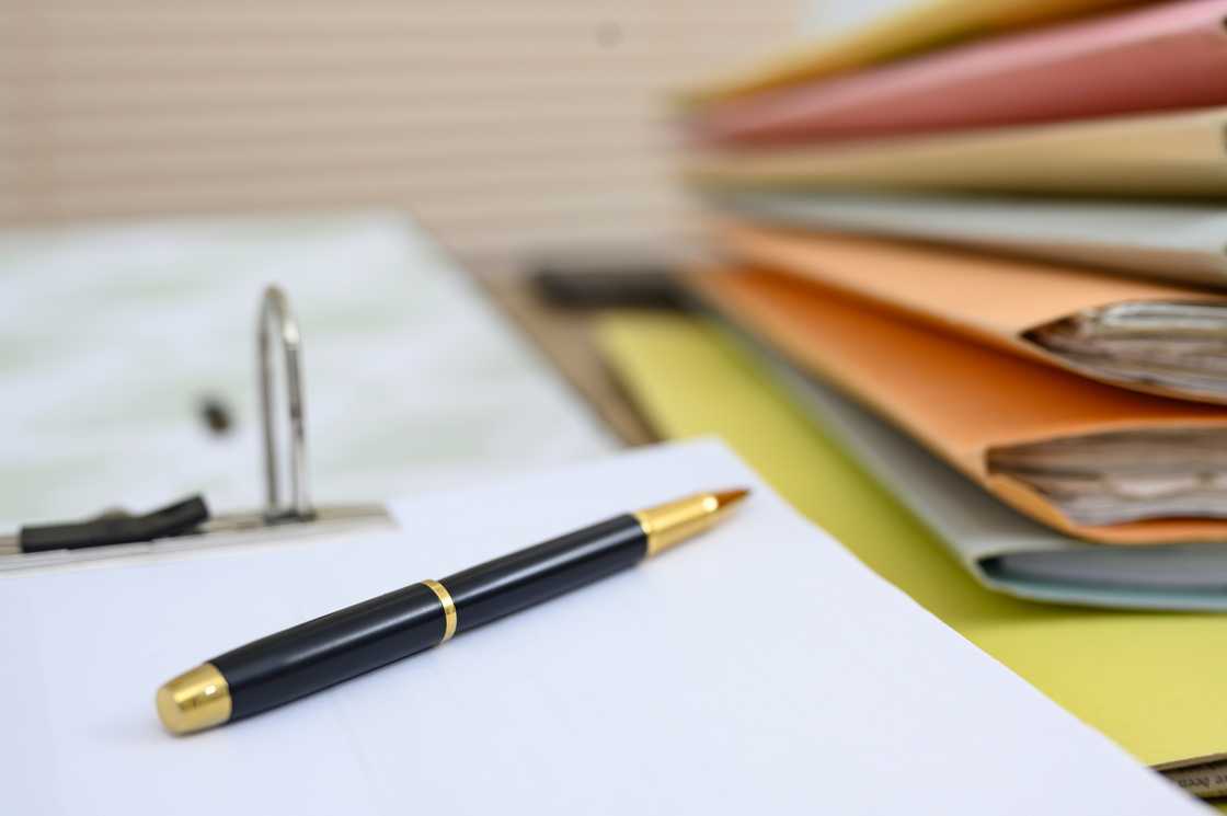 Files and a pen on the desk Files and a pen on the desk