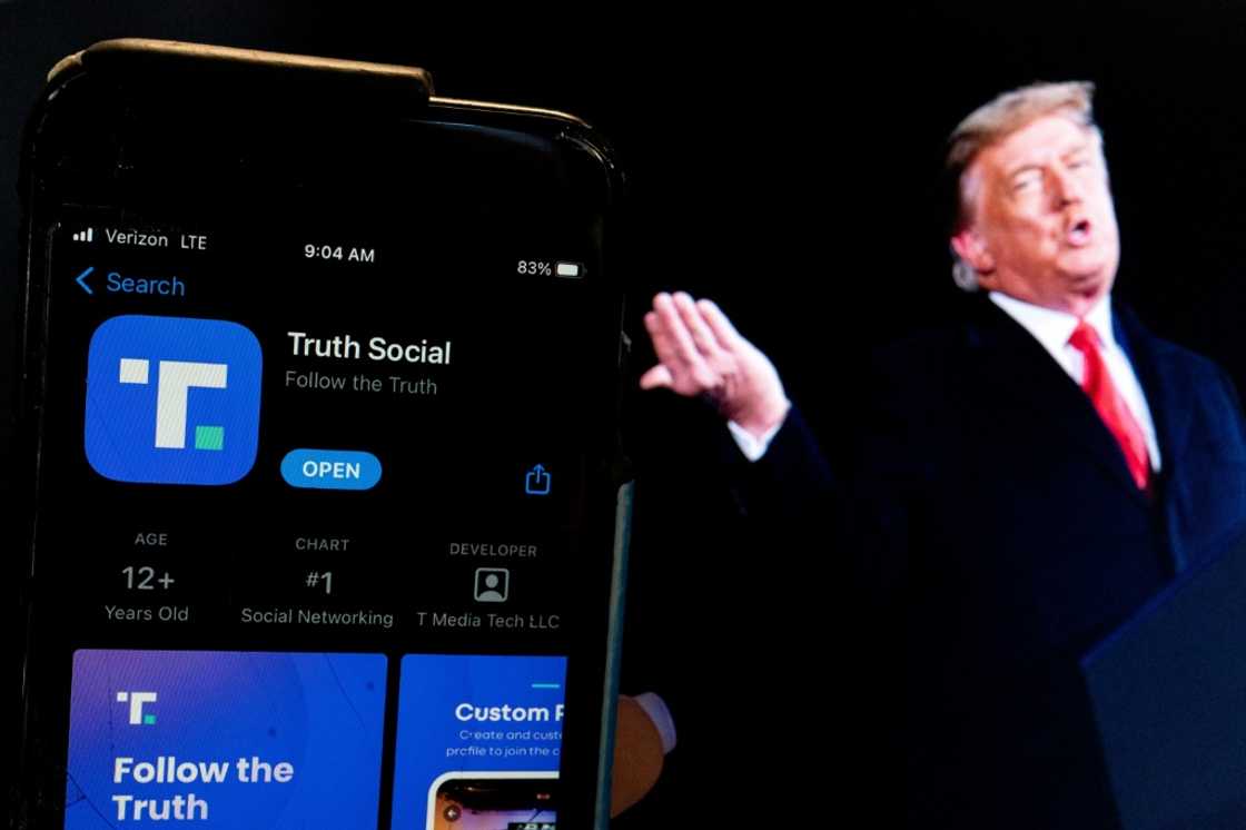 Donald Trump next to a phone screen displaying the Truth Social app Donald Trump next to a phone screen displaying the Truth Social app