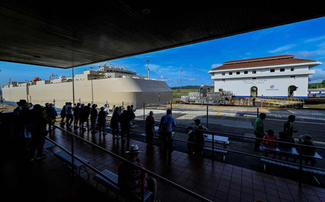 A ship passing through the Miraflores lock in the Panama Canal