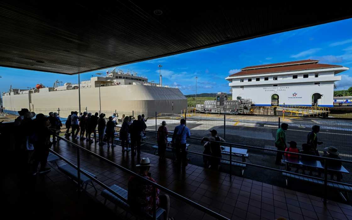 A ship passing through the Miraflores lock in the Panama Canal A ship passing through the Miraflores lock in the Panama Canal