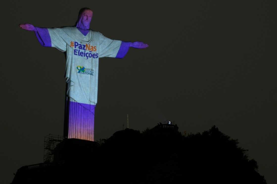 The Christ the Redeemer statue is illuminated with the message "Peace in the Elections" in Rio de Janeiro on October 1, 2022