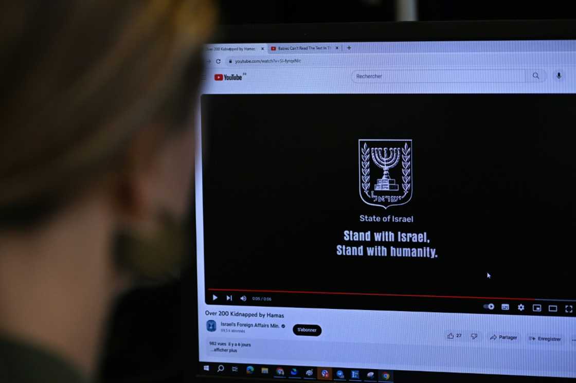 This photograph taken on October 26, 2023, shows a woman looking at a computer screen in Paris, displaying an advertisement on the YouTube platform for a campaign financed by The Israeli Ministry of Foreign Affairs.
Thousands of civilians, both Palestinians and Israelis, have died since October 7, 2023, after Palestinian Hamas militants based in the Gaza Strip entered southern Israel in an unprecedented attack triggering a war declared by Israel on Hamas with retaliatory bombings on Gaza. This photograph taken on October 26, 2023, shows a woman looking at a computer screen in Paris, displaying an advertisement on the YouTube platform for a campaign financed by The Israeli Ministry of Foreign Affairs.
Thousands of civilians, both Palestinians and Israelis, have died since October 7, 2023, after Palestinian Hamas militants based in the Gaza Strip entered southern Israel in an unprecedented attack triggering a war declared by Israel on Hamas with retaliatory bombings on Gaza.