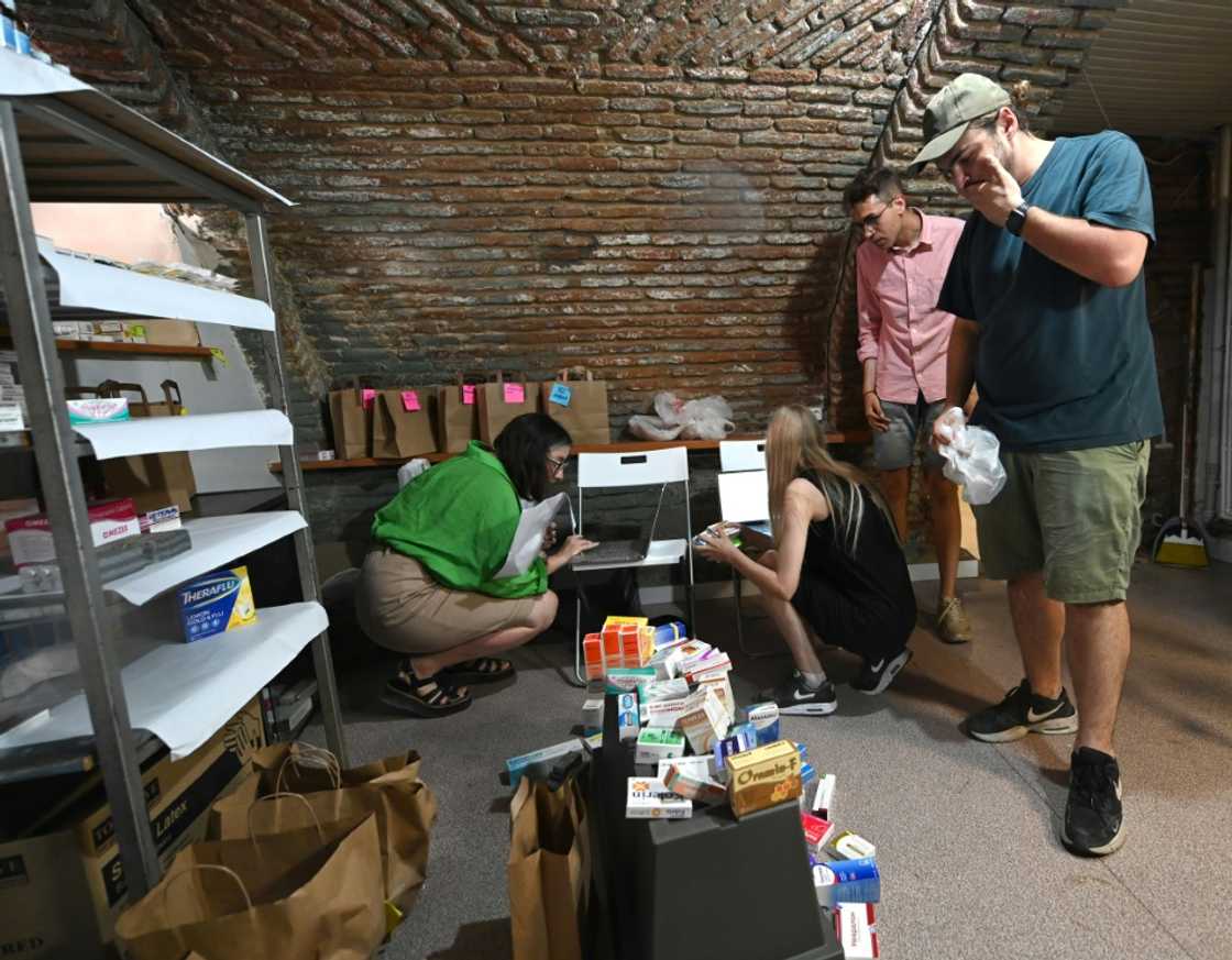 Yevgeny Zhukov, right, helps aids Ukrainian refugees get medical supplies in Tbilisi through the "Emigration for Action" Yevgeny Zhukov, right, helps aids Ukrainian refugees get medical supplies in Tbilisi through the "Emigration for Action"