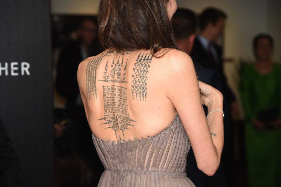 Angelina Jolie, tattoo detail as she attends the "First They Killed My Father" New York premiere in New York City. Angelina Jolie, tattoo detail as she attends the "First They Killed My Father" New York premiere in New York City.