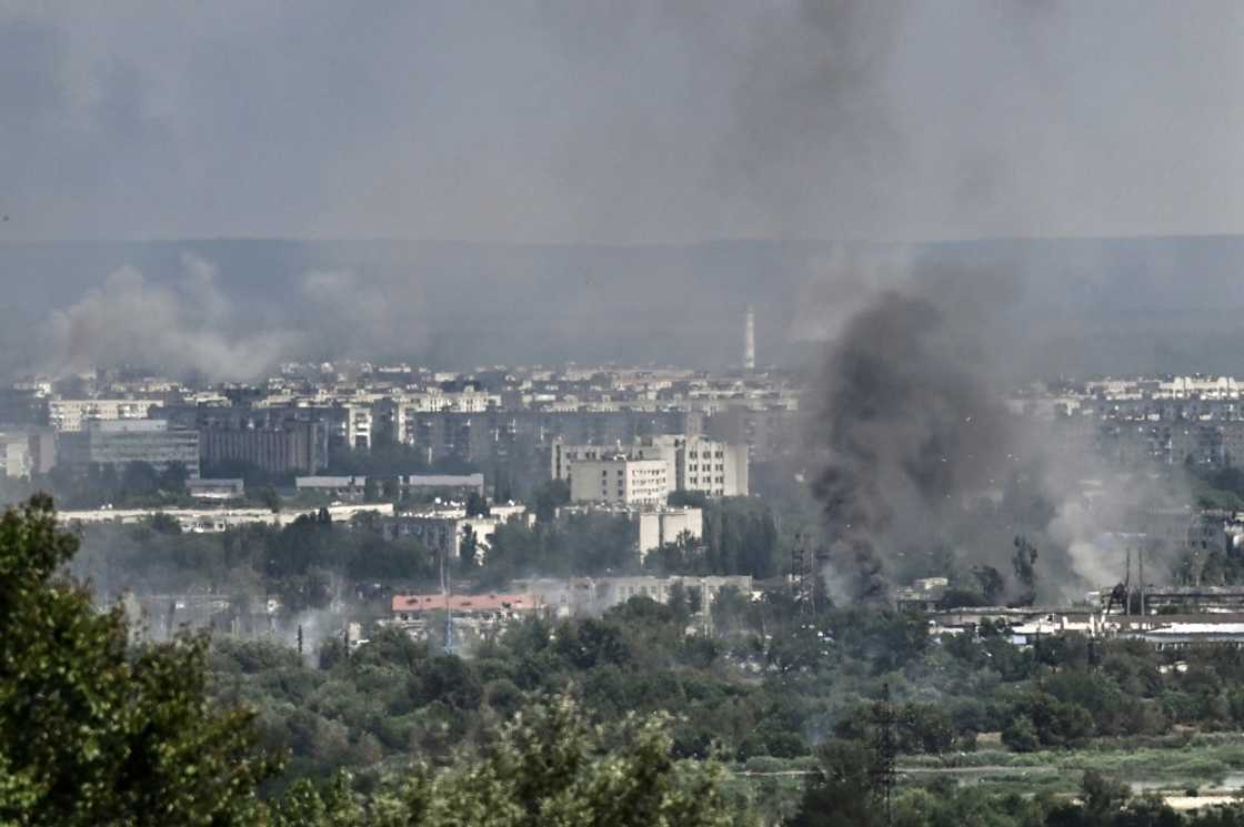 Smoke and dirt rise from the city of Severodonetsk in the eastern Ukrainian region of Donbas on Friday, as the Russian-Ukrainian war enters its 114th day Smoke and dirt rise from the city of Severodonetsk in the eastern Ukrainian region of Donbas on Friday, as the Russian-Ukrainian war enters its 114th day