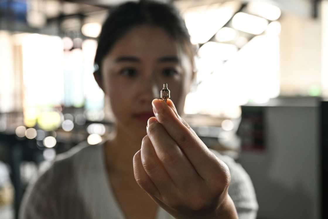 The Qius lost major customers after refusing an offer to move production to Cambodia but have adapted -- recently buying more advanced equipment to automate more of the manufacturing process The Qius lost major customers after refusing an offer to move production to Cambodia but have adapted -- recently buying more advanced equipment to automate more of the manufacturing process