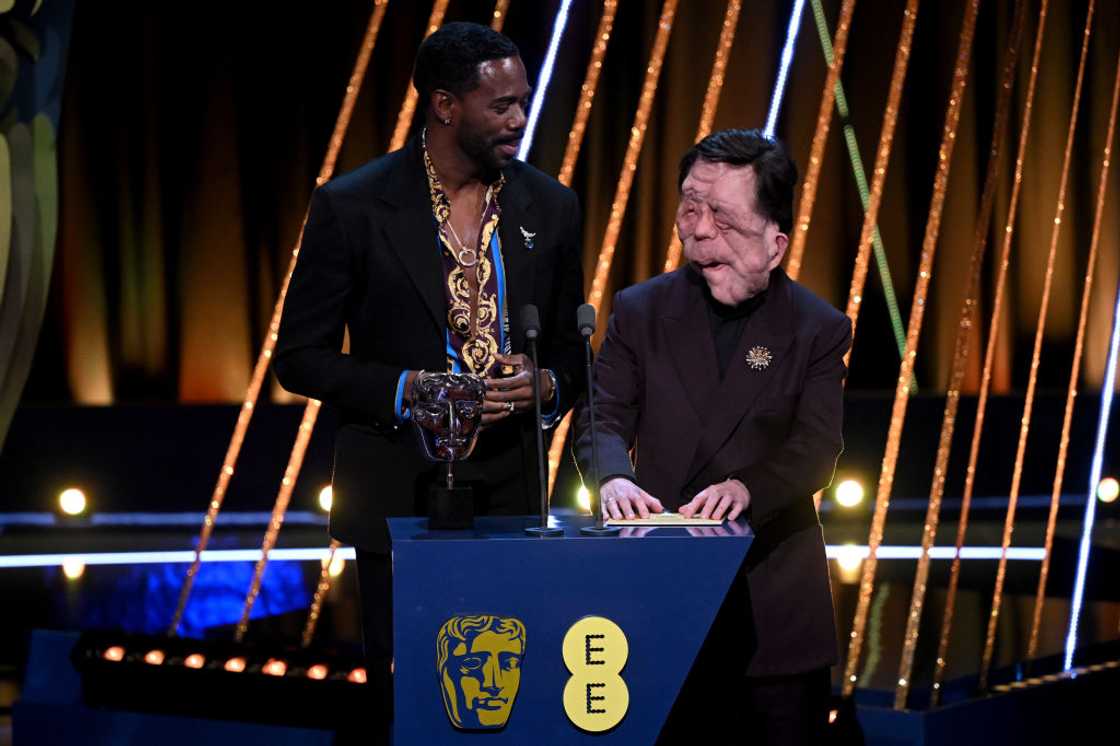 Colman Domingo and Adam Pearson present an award during the EE BAFTA Film Awards Colman Domingo and Adam Pearson present an award during the EE BAFTA Film Awards