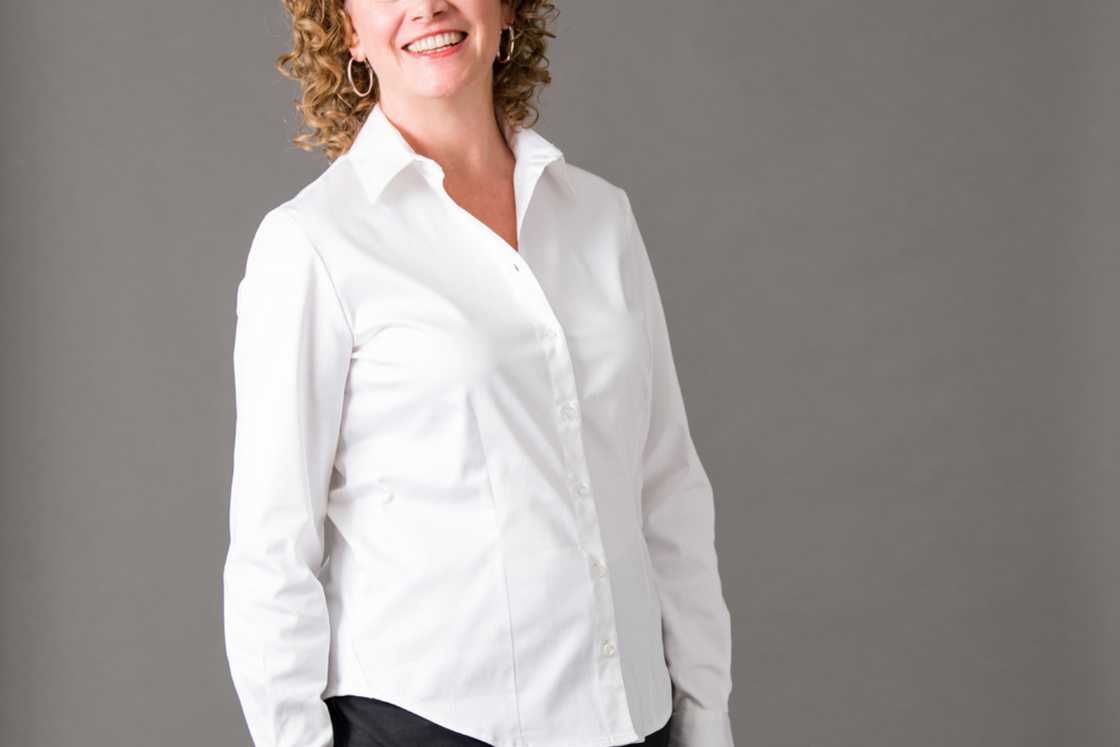 A woman is wearing a white shirt