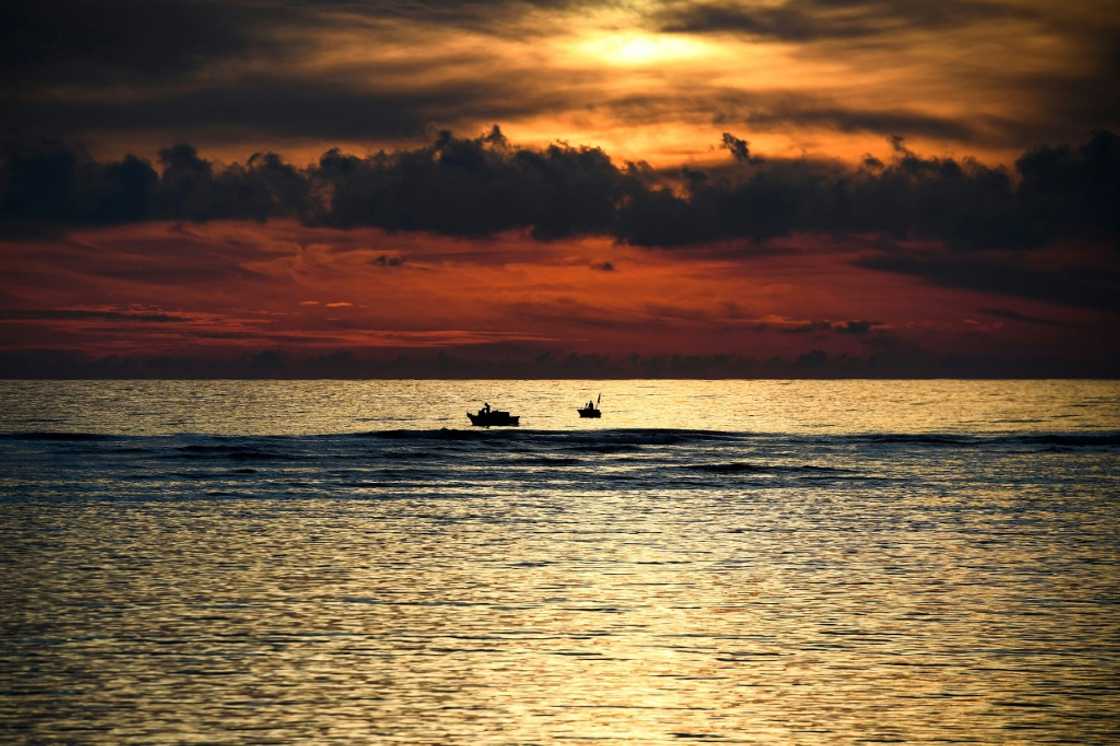 Fishing boats are seen at sunset near Ly Son island in central Vietnam