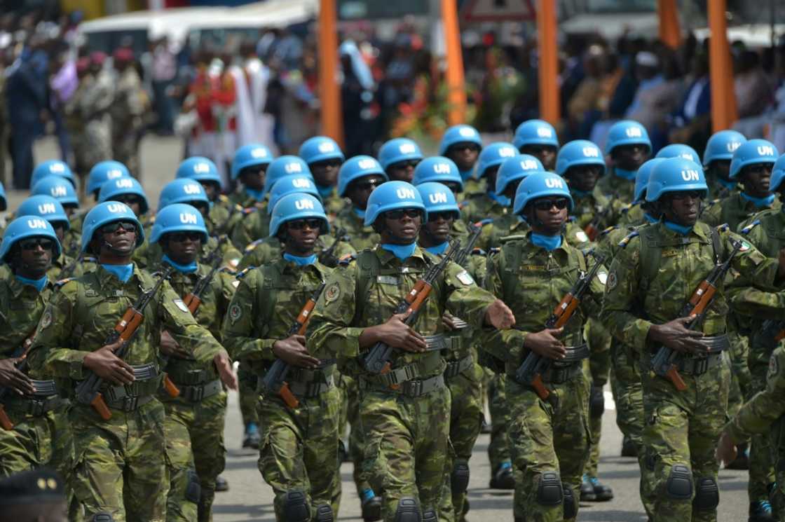 Ivory Coast troops march under the MINUSMA flag in Abidjan Ivory Coast troops march under the MINUSMA flag in Abidjan
