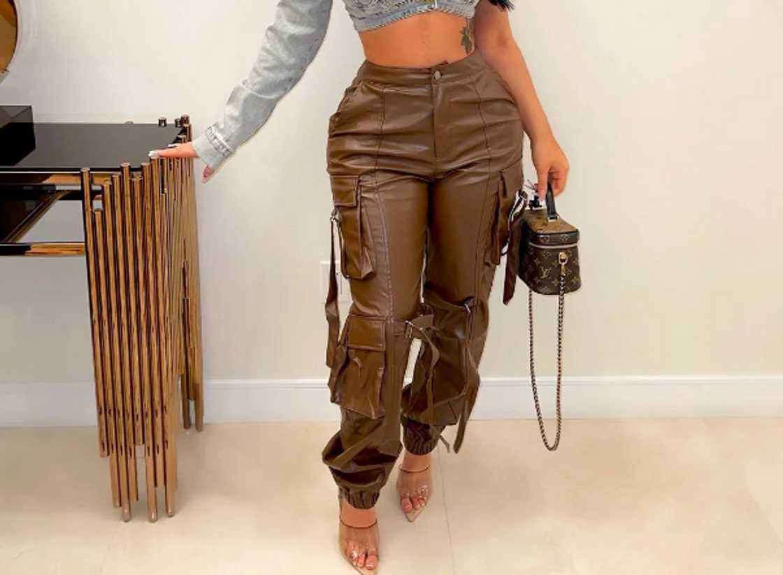 A woman wearing leather cargo pants A woman wearing leather cargo pants