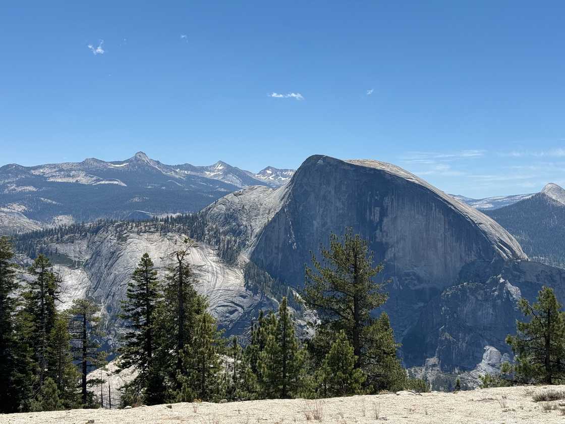 View of Half Dome from the summit of North Dome. View of Half Dome from the summit of North Dome.