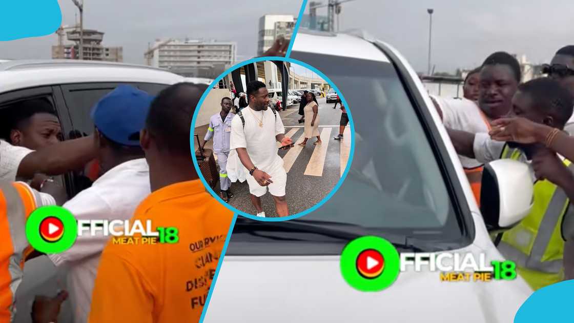 Asamoah Gyan shared money to some staff at the Kotoka International Airport on his arrival. Asamoah Gyan shared money to some staff at the Kotoka International Airport on his arrival.