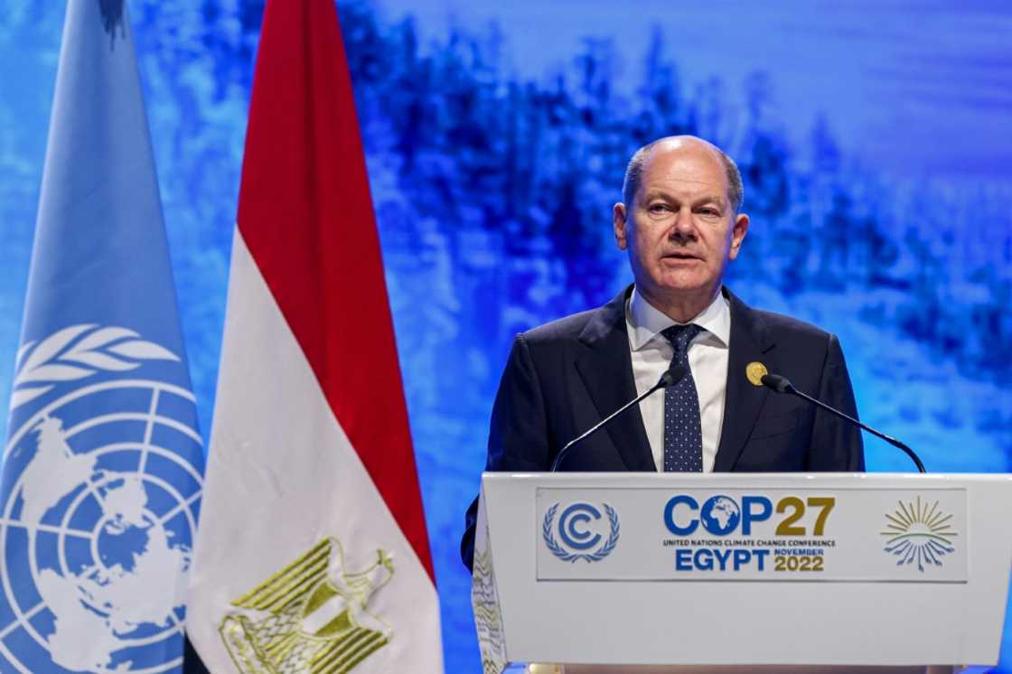 German Chancellor Olaf Scholz delivers a speech at the leaders summit of the COP27 climate conference on November 7, 2022 German Chancellor Olaf Scholz delivers a speech at the leaders summit of the COP27 climate conference on November 7, 2022