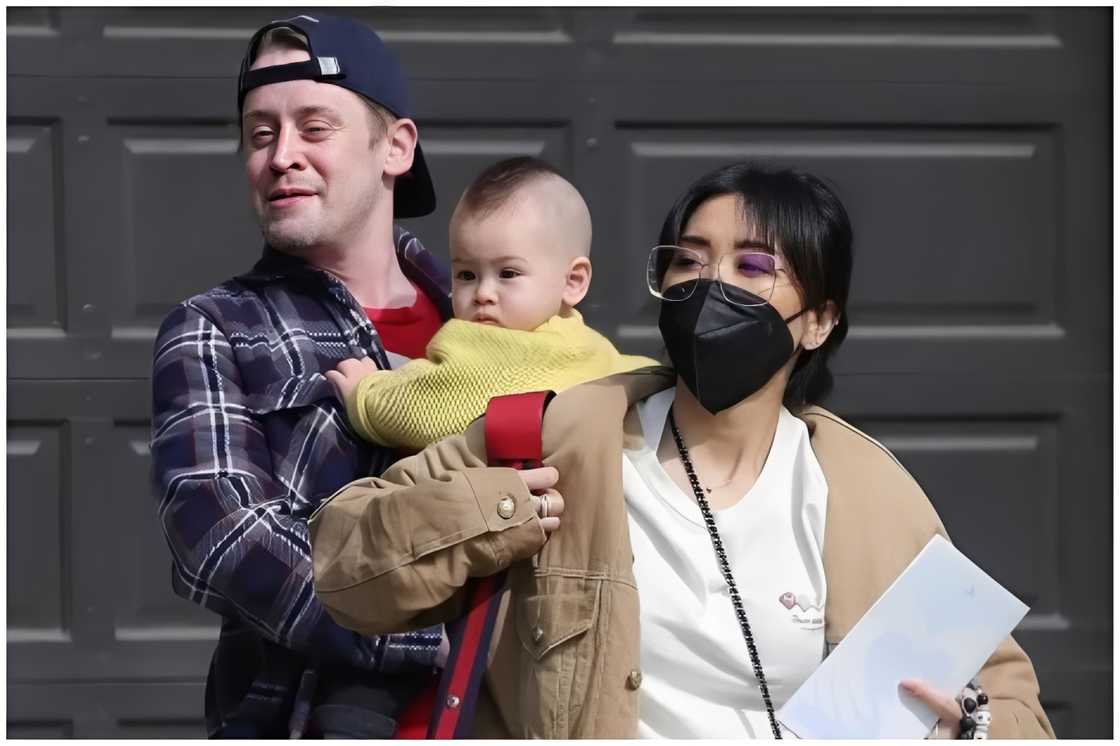 Macaulay Culkin carrying his son Dakota