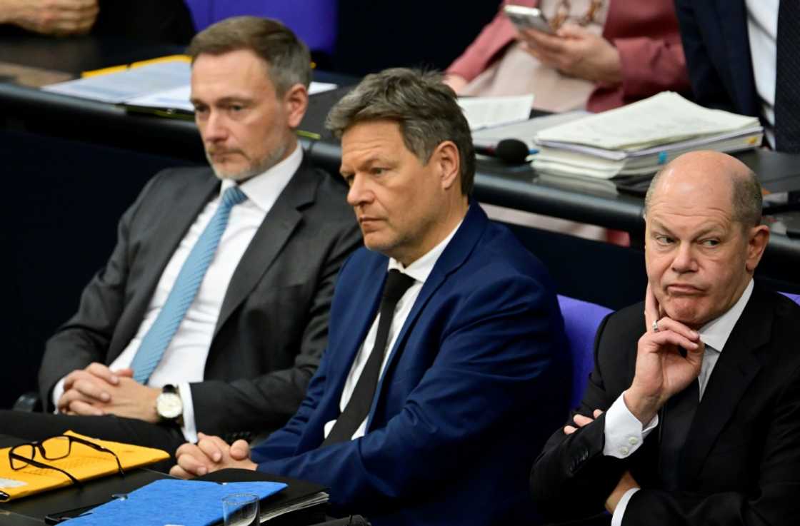 FDP Finance Minister Christian Lindner (L), Greens Economy Minister Robert Habeck (C) and Chancellor Olaf Scholz (R) of the SPD are locked in a budget dispute FDP Finance Minister Christian Lindner (L), Greens Economy Minister Robert Habeck (C) and Chancellor Olaf Scholz (R) of the SPD are locked in a budget dispute