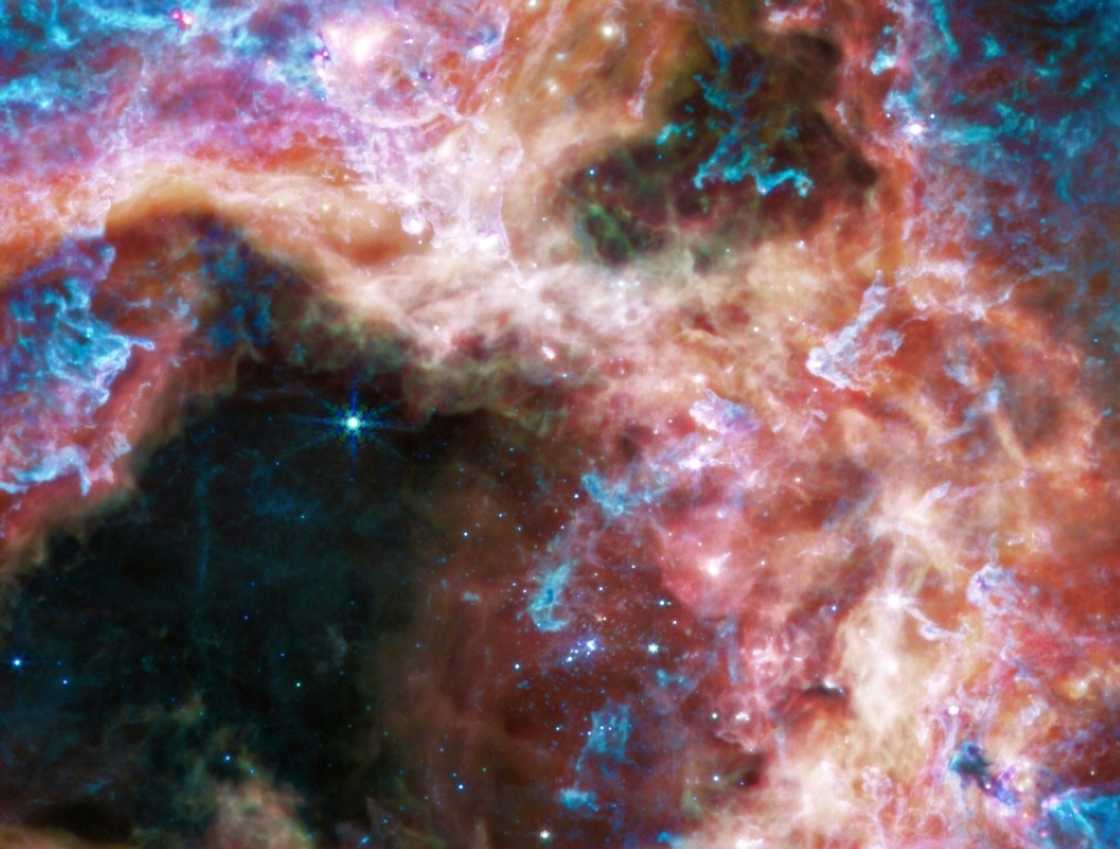 The region was also imaged using the Mid-infrared Instrument (MIRI), which uses longer wavelengths of infrared to pierce through dust grains that absorb or scatter shorter wavelengths The region was also imaged using the Mid-infrared Instrument (MIRI), which uses longer wavelengths of infrared to pierce through dust grains that absorb or scatter shorter wavelengths