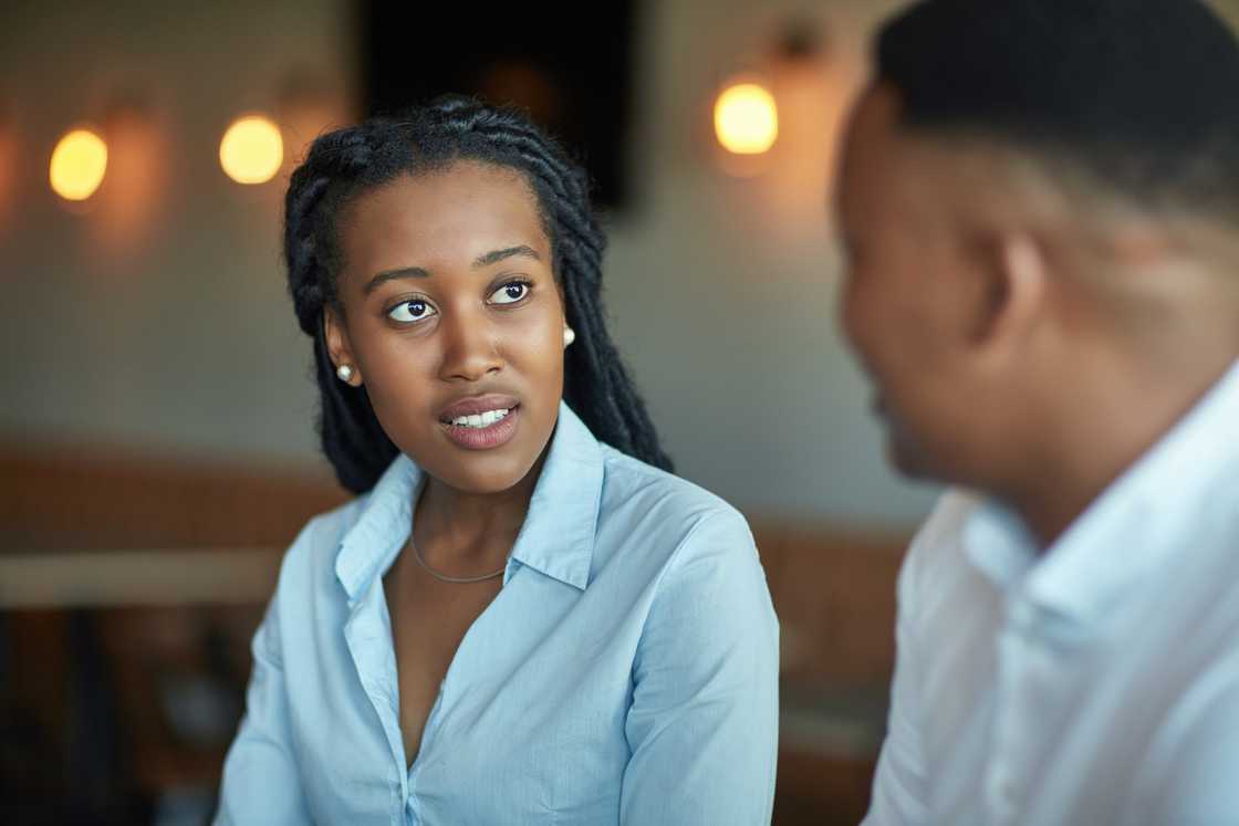 Male and female professionals discussing business