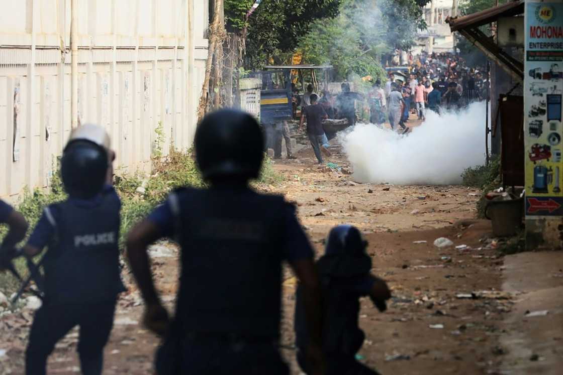 Bangladesh police fire tear gas to disperse striking garment workers in Ashulia who are demanding a near-tripling of their wages to about $209 a month Bangladesh police fire tear gas to disperse striking garment workers in Ashulia who are demanding a near-tripling of their wages to about $209 a month