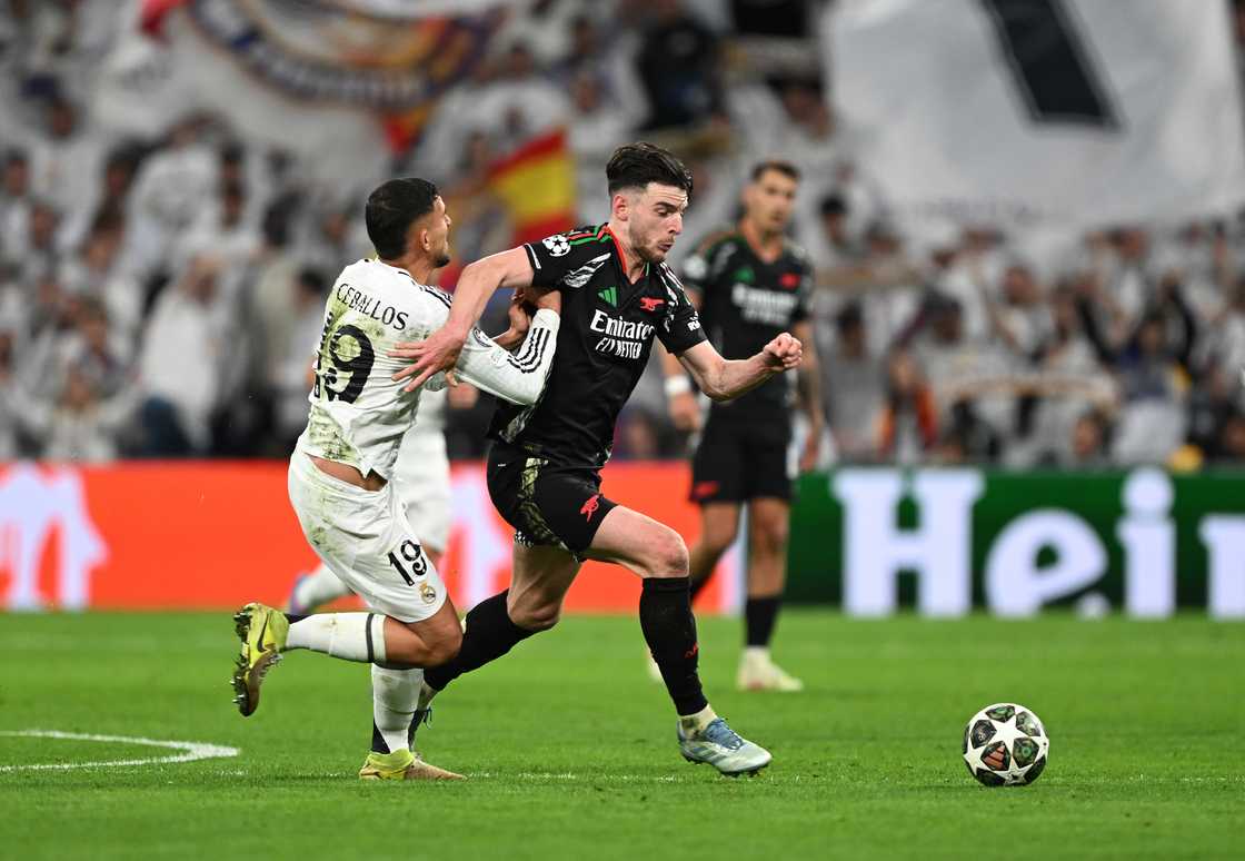 Declan Rice of Arsenal is challenged by Dani Ceballos of Real Madrid in the Real Madrid 1 Arsenal 2 UCL QF second leg on April 16, 2025 in Madrid, Spain Declan Rice of Arsenal is challenged by Dani Ceballos of Real Madrid in the Real Madrid 1 Arsenal 2 UCL QF second leg on April 16, 2025 in Madrid, Spain