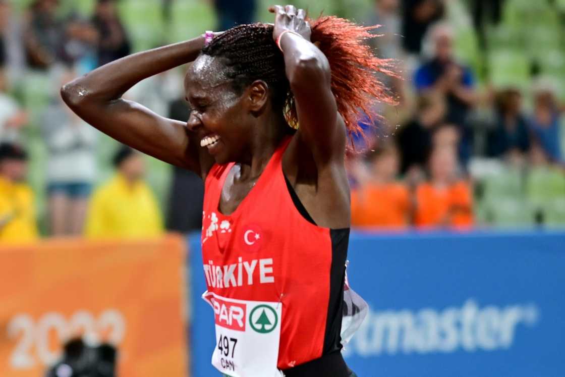 Turkey's Yasemin Can celebrates her victory in the women's 10,000m