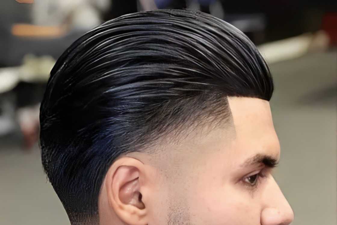 A white is rocking a black slicked back hairstyle A white is rocking a black slicked back hairstyle