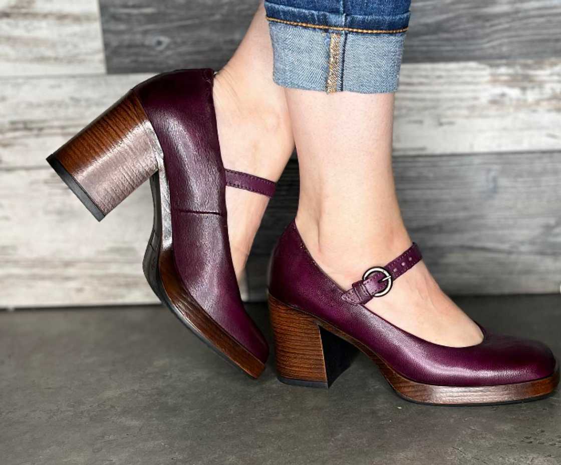 A pair of purple Mary Jane pumps