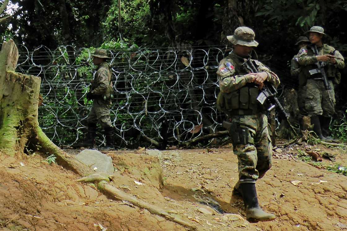 Panamanian soldiers posted at the entry to the Darien jungle in July 2024