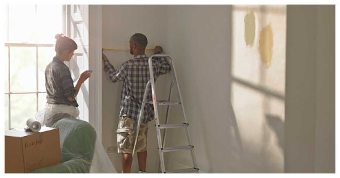 Two people working on some home renovations