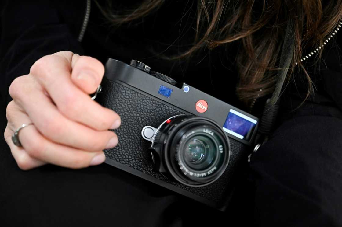 German photographer Franziska Stuenkel holds an M11 Leica camera during an interview with AFP in Frankfurt German photographer Franziska Stuenkel holds an M11 Leica camera during an interview with AFP in Frankfurt